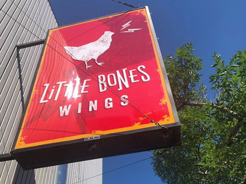Exterior signage at Little Bones Pizza, Brandon, Manitoba