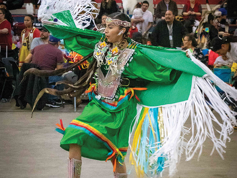Dancer in green dress at Dakota Nation Winter Fest in 2020