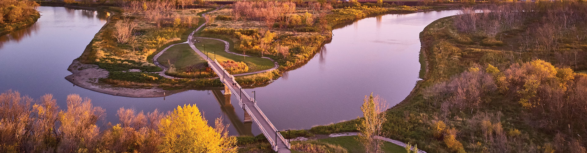The Red Willow Pedestrian Bridge spans the Assiniboine River in Brandon, Manitoba