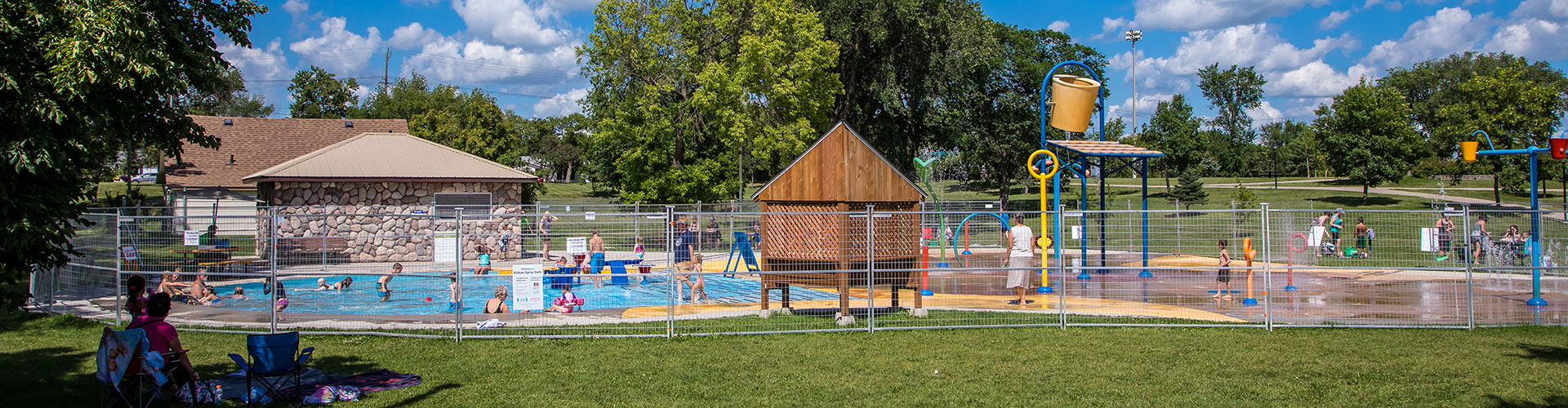 Outdoor swimming pool and spray park at Rideau Park in Brandon, Manitoba