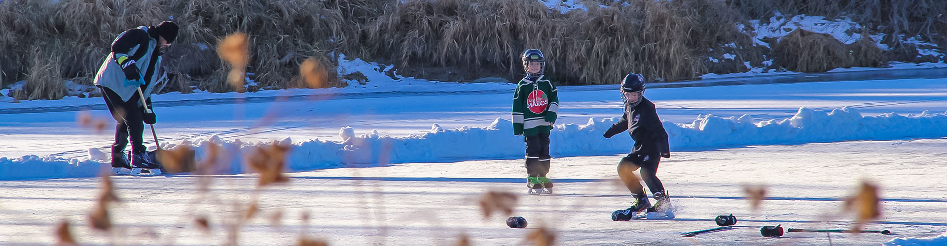People playing pond hockey, Brandon, Manitoba
