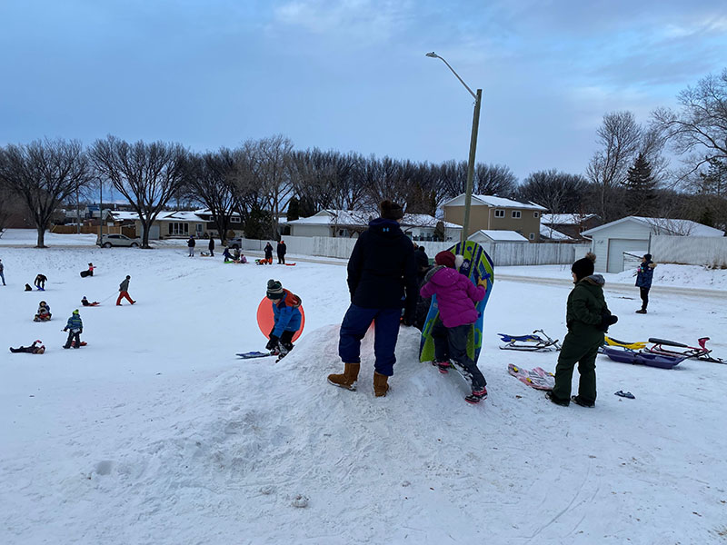 Sledding fun at the Sugar Bowl, Brandon, Manitoba